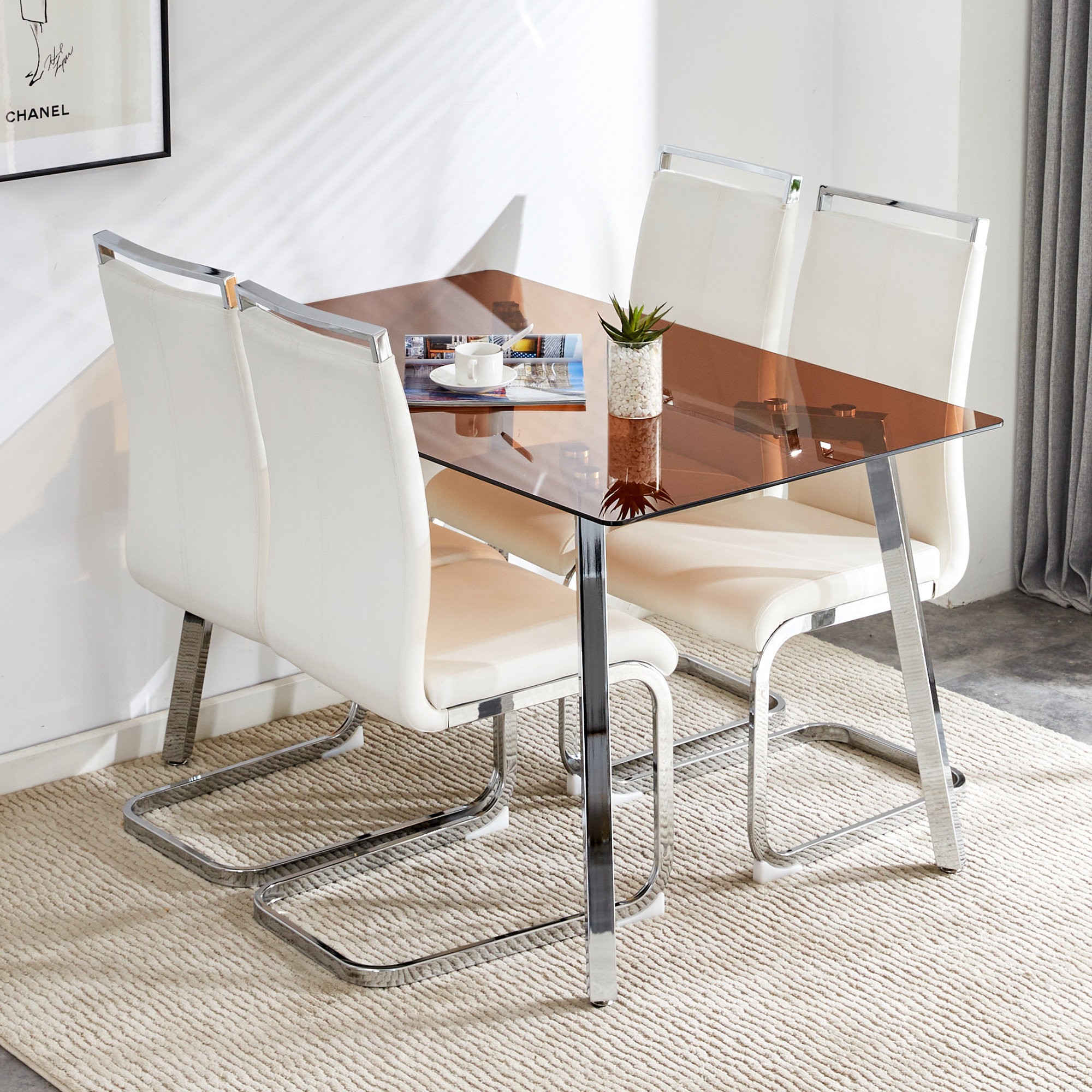 View of Brayden Studio Modern glass dining set: brown tempered top, silver ...